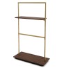 Portant avec crémaillère. Portant évolutif et modulable au design soigné. Mobilier professionnel pour l'agencement de magasin